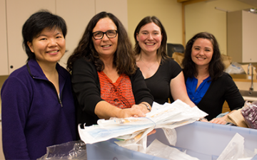 Cathy Ellis flanked by UBC Midwifery students Nancy Hsiao-Lan Tsao (far left), Jacquelyn Thorne and Rachelle Fulford (far right).